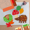 16 gebastelte Kastanienkumpel-Motive: Igel, Kastanienmännchen, Pilze, Eicheln, Blätter und Apfel aus buntem Papier