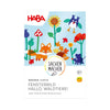 Verpackung Vorderseite Bastelset Fensterbild Hallo, Waldtiere! von HABA mit bunten Tieren und Blumen auf blauem Hintergrund